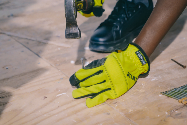 Costa Mesa Person Hammering Nail on a Wooden Surface