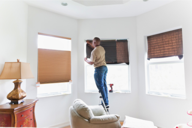 Window treatment installer installs shades