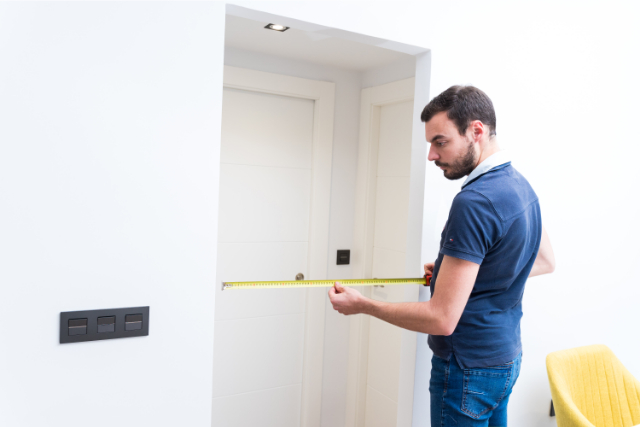 Costa Mesa Young handyman working with measure tape